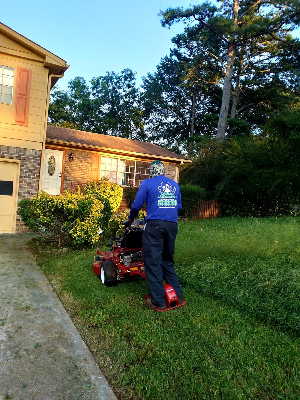Damaso Landscaping crew mowing a lawn in Atlanta, GA